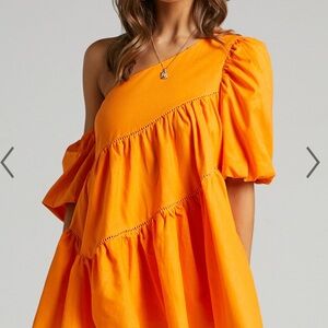 SHOWPO HARLEEN MINI DRESS - ASYMMETRICAL TRIM PUFF SLEEVE DRESS IN ORANGE